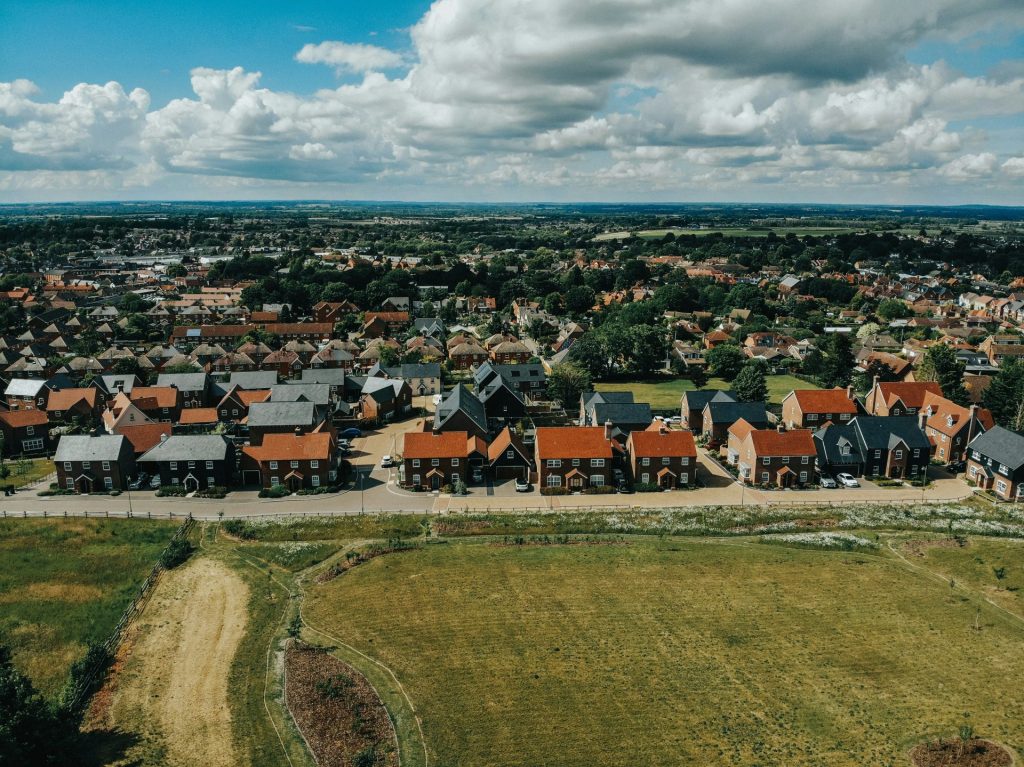 brown and white houses under blue sky during daytime